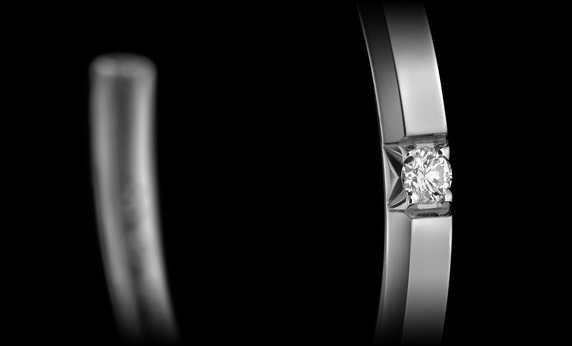 Close-up of one of the 5 diamonds decorating Montluc - Halo No 4 hoop earrings